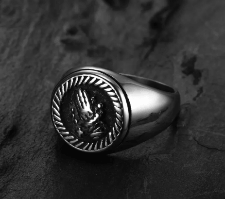 Nordic titanium steel ring featuring a sleek black design with a detailed emblem.