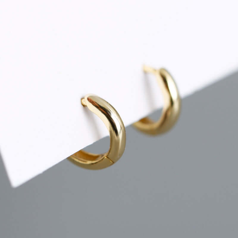 S925 silver round hoop earrings in gold, showcasing a sleek design with a polished finish, perfect for elegant looks.