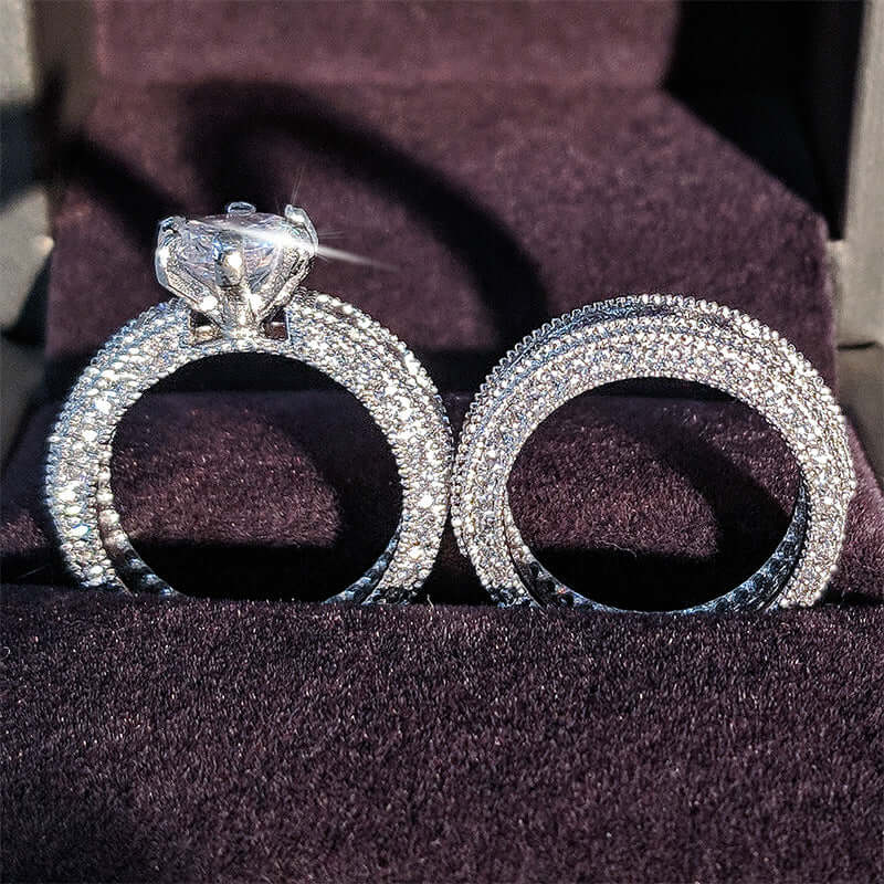 Stunning 925 sterling silver engagement ring with sparkling accents displayed elegantly on a velvet background.
