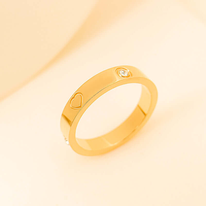 Rhinestone titanium steel bracelet ring in gold with heart design and sparkling gemstone detail.