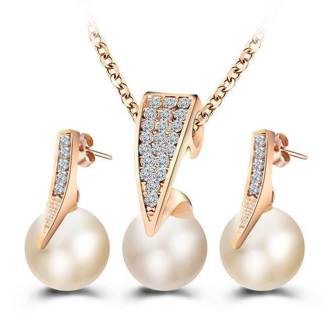 Bridal pearl necklace and earrings set featuring elegant rose gold and diamond-encrusted design, perfect for weddings.