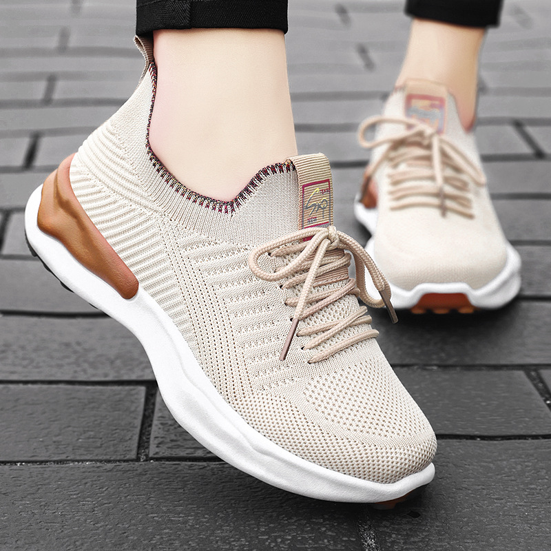 Breathable casual running shoes for women in beige color, featuring round toe and flat heel design.