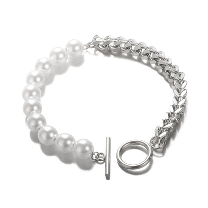 Elegant pearl and chain bracelet for women, featuring a toggle closure and modern design.