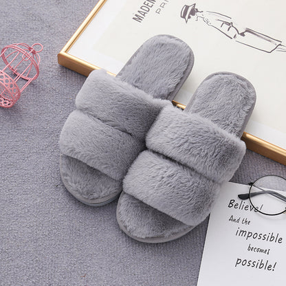 Furry open-toed home slippers in grey with soft rabbit fur upper for cozy wear and relaxation.