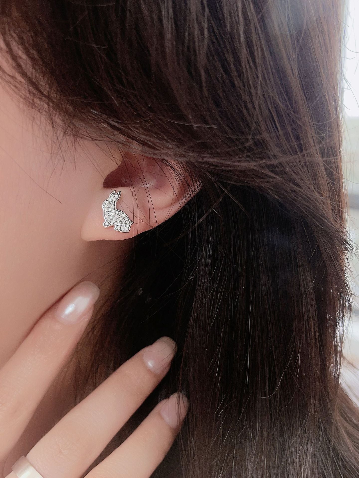 Rabbit and Carrot silver earrings displayed on model&