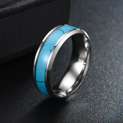 Stainless Steel Turquoise Fashion Rings showcasing a stylish blue inlay and durable design on a textured surface.