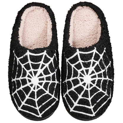 Pumpkin plush slippers with spider web design, soft and comfy for indoor and outdoor use.