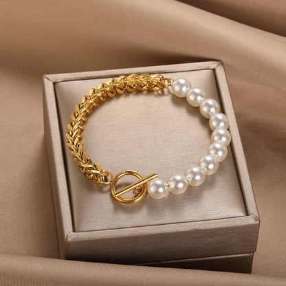 Stainless Steel OT Buckle Bracelet for Women featuring gold links and white pearls in a gift box.
