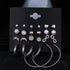 12 pairs of star and moon diamond earrings set featuring silver designs with intricate geometric shapes and sparkling accents.