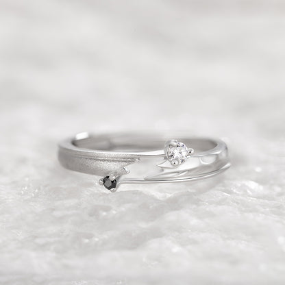 Adjustable sterling silver couple ring featuring a modern geometric design with black and clear stones, perfect for couples.