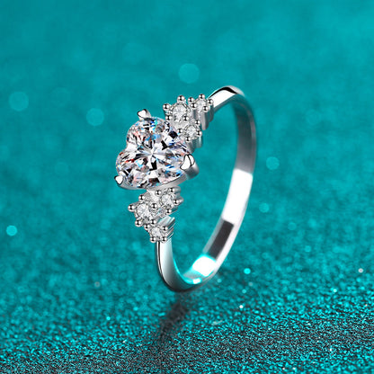 Heart moissanite engagement ring featuring a stunning heart-shaped moissanite center and delicate silver band.