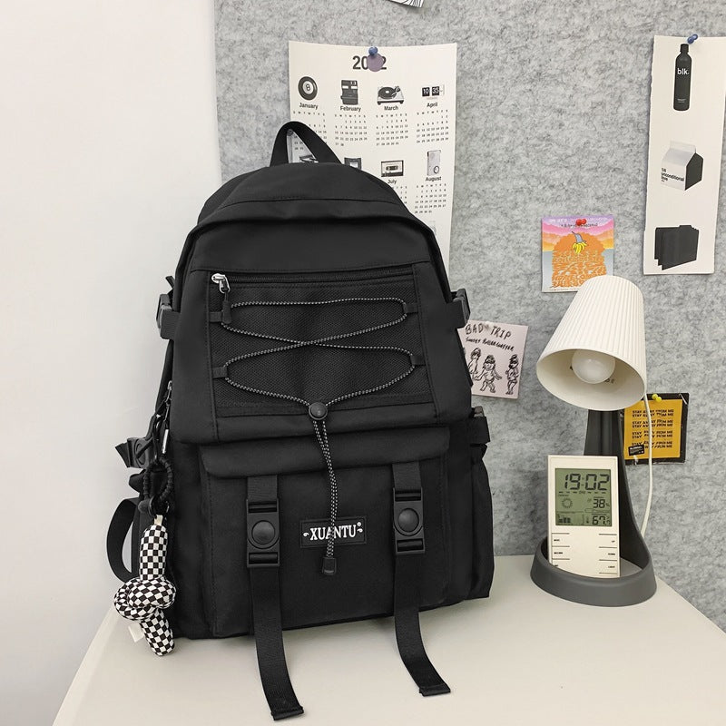Stylish black student backpack for high school with functional design and premium polyester material.